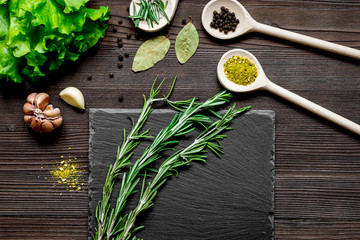 spices and fresh herbs on wooden table top view