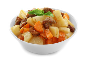 Bowl with tasty meat and potatoes on white background