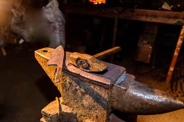 Forge, anvil, knife making.