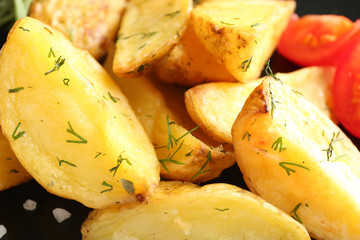 Delicious baked potato wedges, close up