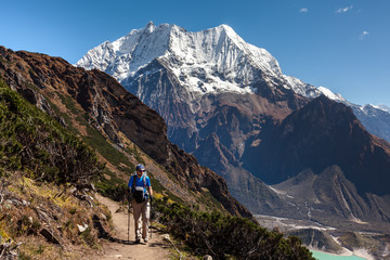 Obraz premium Hiker is climbig to Manaslu base camp in highlands of Himalayas on Manaslu circuit