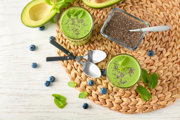 Smoothies with chia seeds in glasses on table