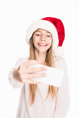 teenager in santa hat taking selfie