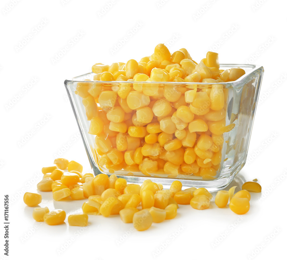 Wall mural bowl and canned corn kernels on white background