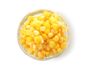 Bowl with canned corn kernels on white background
