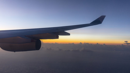 Sunset and Clouds Viewed from the Window of a Modern Airliner