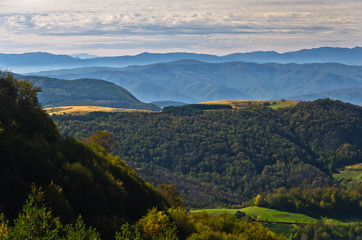 Fototapeta premium Viewpoint on a landscape of mount Bobija, hills, meadows and colorful forests, west Serbia