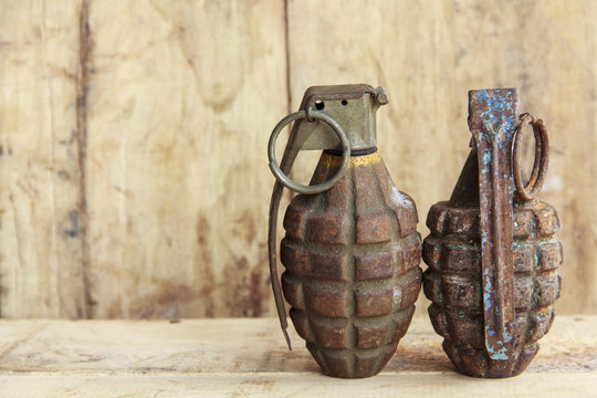 Grenade on old wood for background and texture