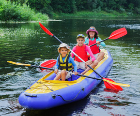 Family kayaking on the river