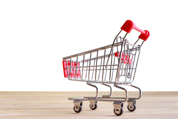   Shopping Cart isolated on wood and white background.