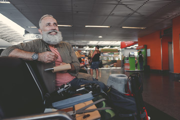 Beaming grandfather writing in notebook