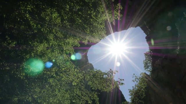 Slow motion sun flares through Vratna gates footage - Eastern Serbia natural wonder slow-mo video 