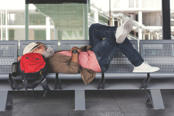 Tired man waiting for flight