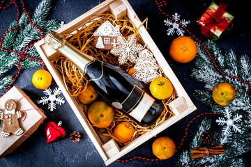 New Year's champagne and tangerines in box top view