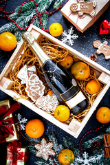 New Year's champagne and tangerines in box top view