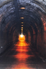 Obraz premium The sun at the end of the tunnel in Banos de Agua Santa, Ecuador