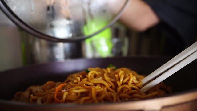 use chopsticks on noodle, homemade cook