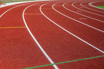 Fototapeta premium Red treadmill in sport field.