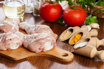 Raw chicken legs with spices