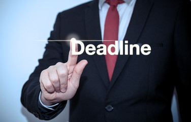 Businessman pressing on virtual screen and selecting deadline