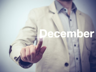 Businessman pressing button on virtual screen December button - concept
