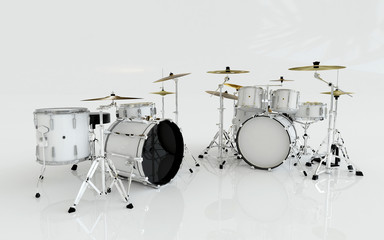 two white drums with different set in the white room