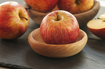 Ripe unpeeled juicy red yellow apples fall 