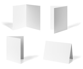 close up of a  blank folded leaflet or a desktop calendar white paper on white background 