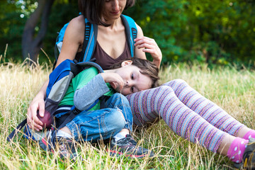 Fototapeta premium child is resting by the mother in her arms