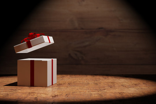 Offenes Geschenk auf Holz