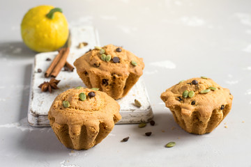 Autumn pumpkin muffins with spices, chocolate drops and pumpkin
