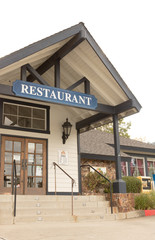 Front of rustic style restaurant, restaurant sign