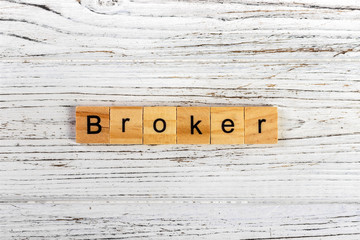 BROKER word made with wooden blocks concept