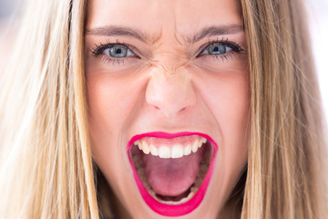 Angry young girl, portrait photo with copy space