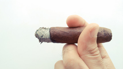 Man hand holding cigar