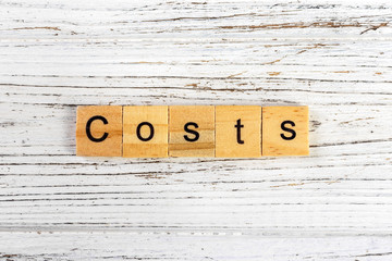 COSTS word made with wooden blocks concept