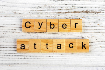 cyber attack word made with wooden blocks concept