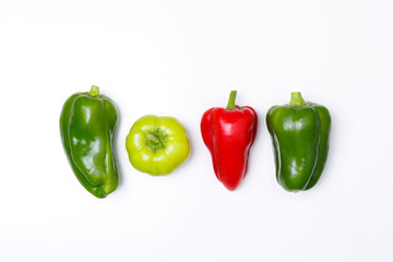 Top view of a red and green paprika on a white background. Minimal concept of a healthy diet.