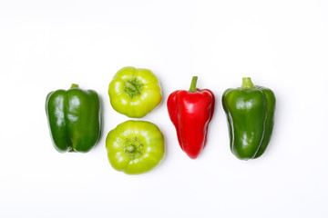 Top view of green pepper, red paprika on white background. Minimal concept. Vegan food. 