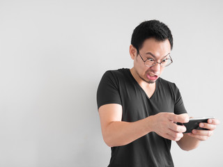 Angry man is losing the mobile game.