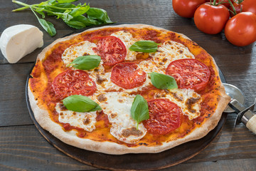 Fresh Pizza on Wood Table