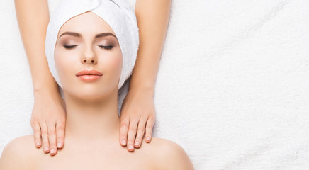 Portrait of a woman in spa. Massage healing procedure. Health care, skin lifting and medical concept.