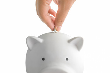 White piggy for money saving with coin in hand on white background