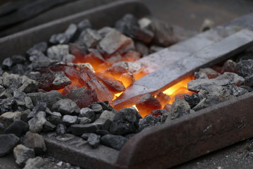blacksmith wotk with hammer and hot iron