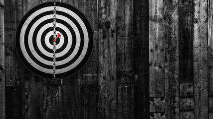 darts arrows in the target center,light to center ,black and white photography..