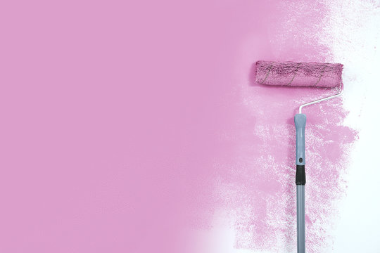 Paint Roller Next To The Pink Wall.