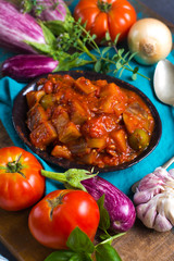 Best italian food - sicilian caponata with eggplants, tomatoes, onion, garlic and herbs