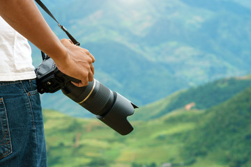 photographer taking camera for adventure travel in natural view
