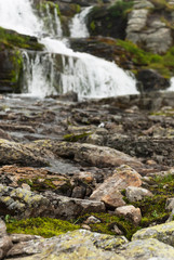 Waterfall in the mountains along the National tourist route Aurl