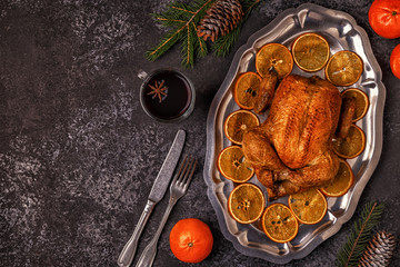 Roasted whole chicken with Christmas decoration.